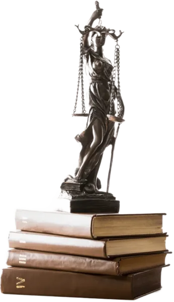bronze scales of justice figurine on brown books