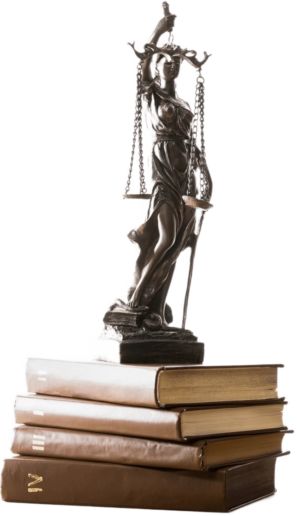 bronze scales of justice figurine on brown books