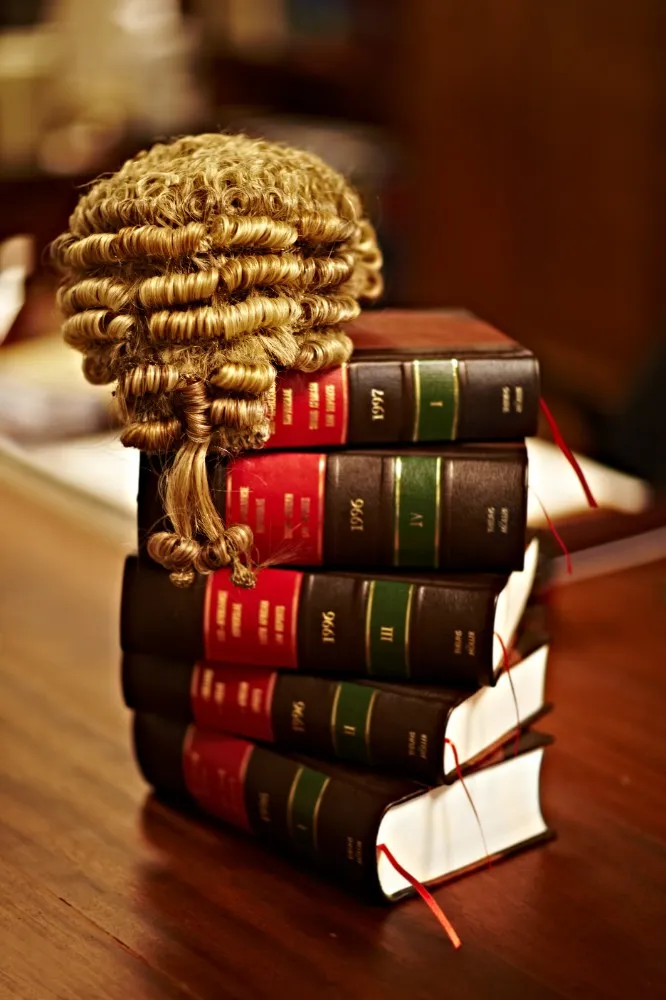 law books and a wig