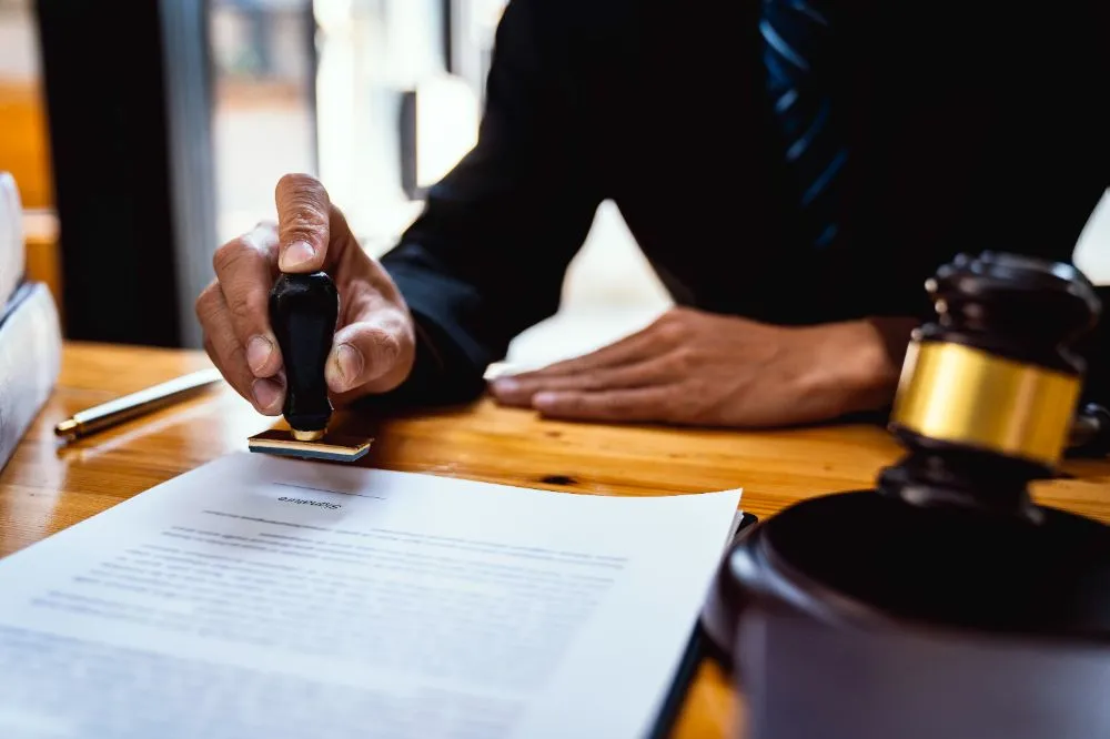 lawyer stamping a contract